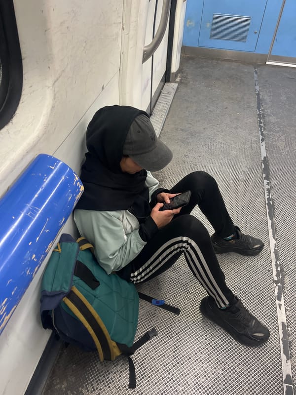 Person in athletic wear rests on bench in Victoria