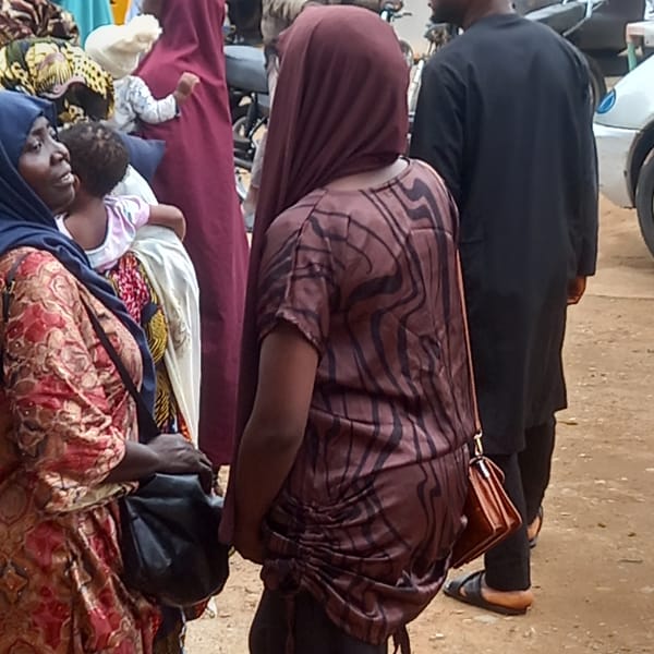 Families with luggage gather in Nigerian towns
