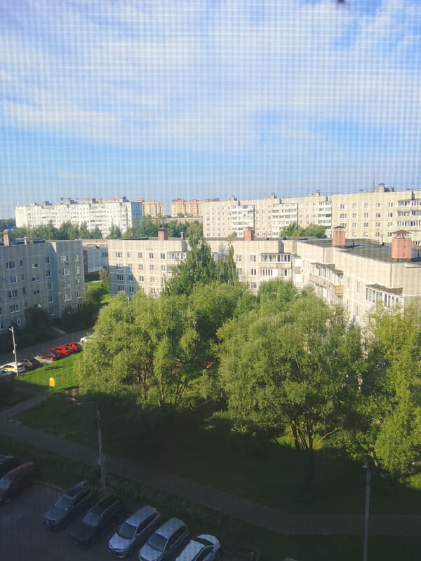 Aerial look at Yegoryevsk apartment blocks amid green trees