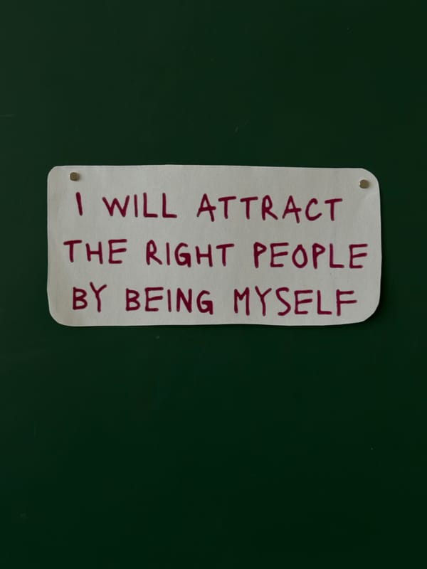 Motivational signs with self-affirmation messages displayed on green walls