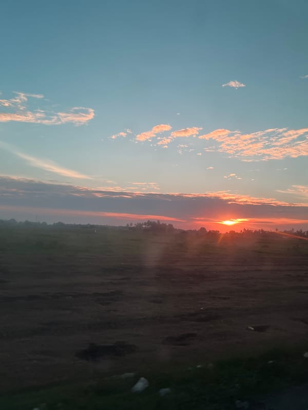 Golden hour skies over Meunasah Pupu, sun low on the horizon