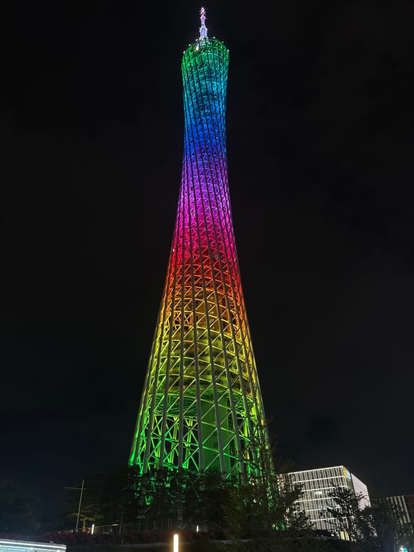 Canton Tower evening lights and Pearl River waterfront activity