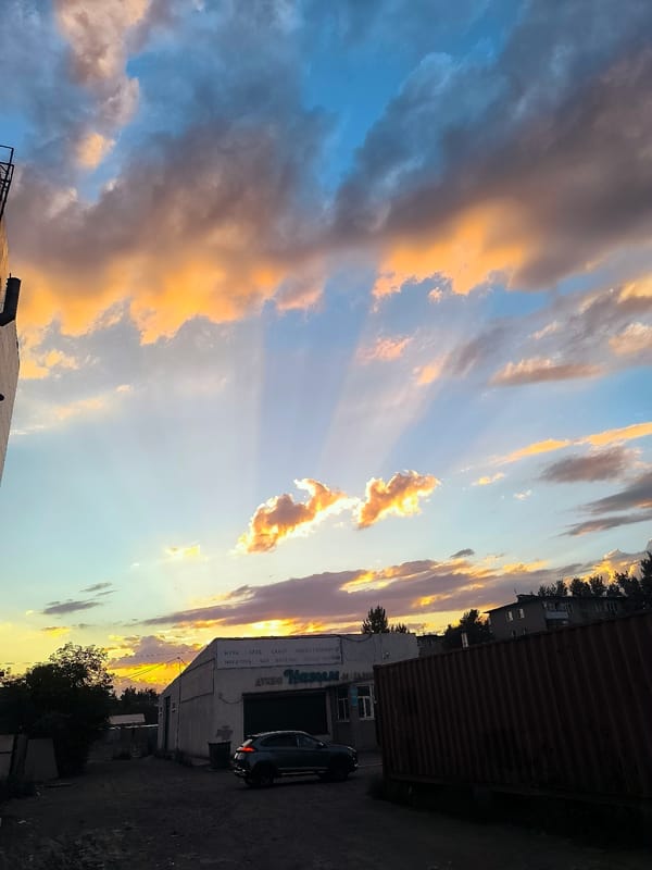 Sunset clouds glow over industrial Qarağandı, Kazakhstan