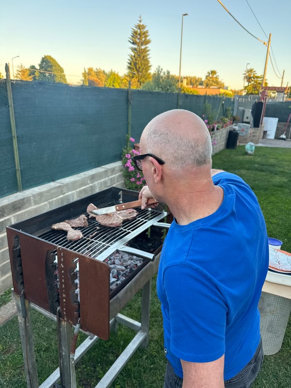 Backyard barbecue with family and dog in Aprilia, Italy