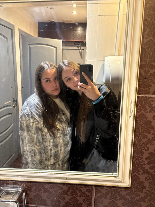 Two women take bathroom mirror selfie in Izhevsk