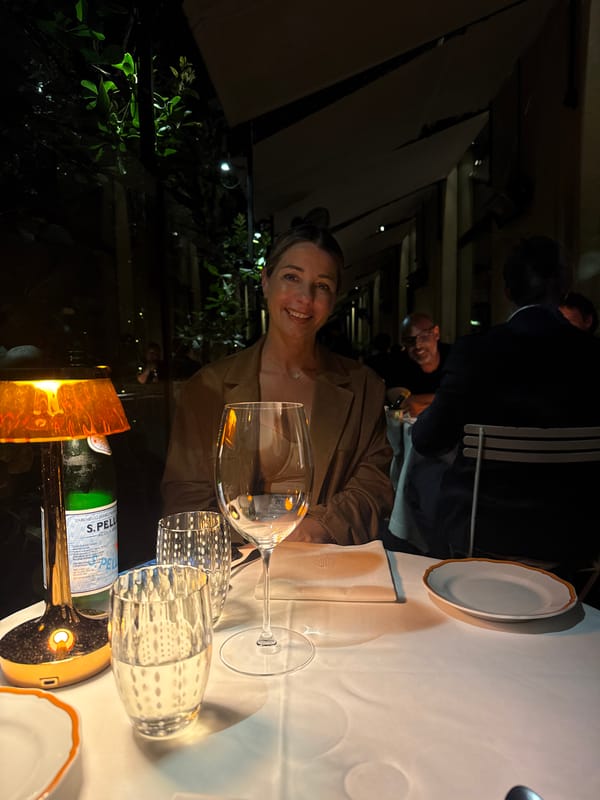 Woman enjoys outdoor dining in Milan evening