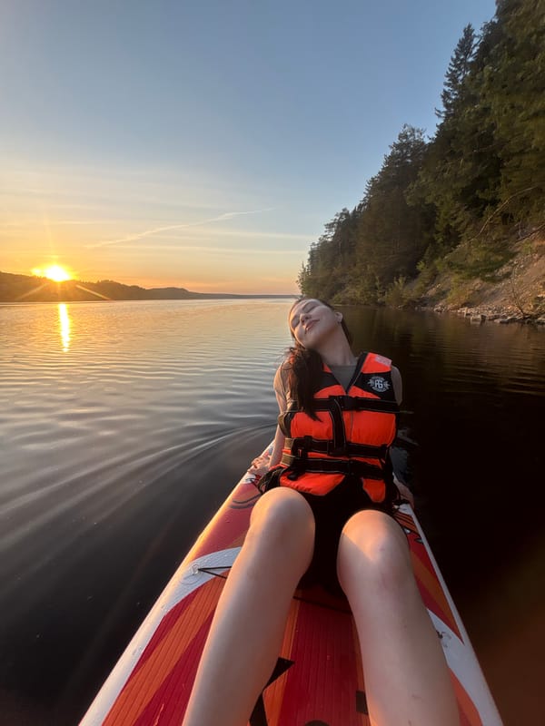 Paddleboarder enjoys sunset waters near Khokhlovka, Russia