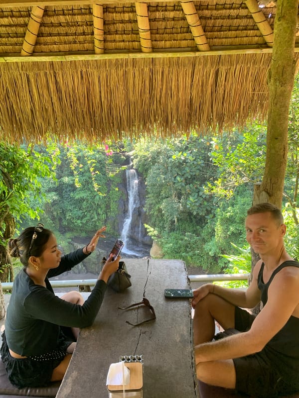 Waterfall dining experience in Blahbatuh's tropical landscape