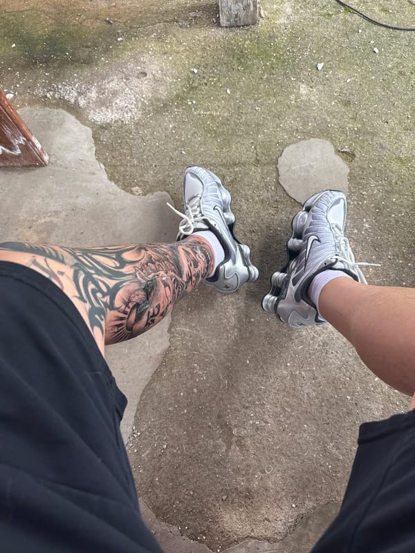 Tattooed person with white cat observed in Burgas, Bulgaria