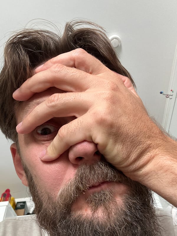 Close-up selfie with hands partially covering face, Fethiye