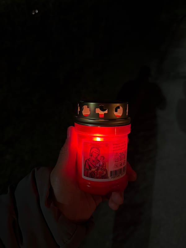 Memorial candle lit during nighttime gathering in Panagyurishte, Bulgaria