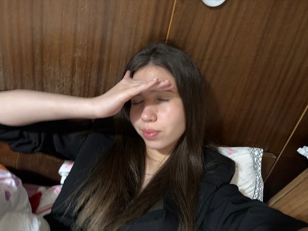 Woman rests in bed in Gabrovo, Bulgaria