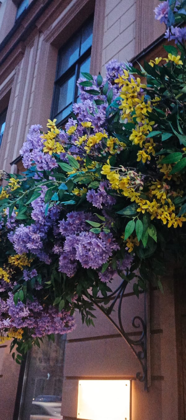 Decorative street displays along a Saint Petersburg evening block