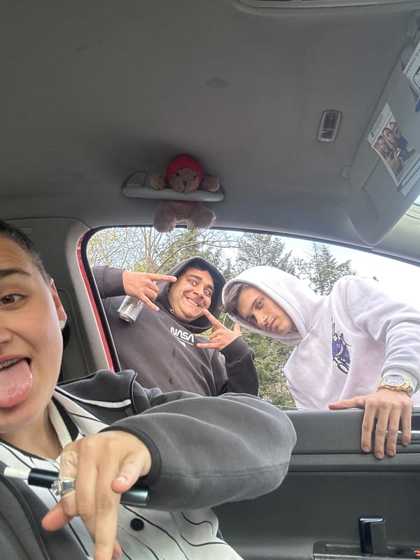 Three young men share playful moment in Sopot, Bulgaria