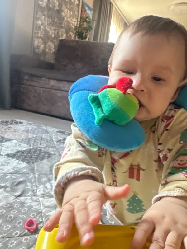 Baby's day in Christmas pajamas, toys, and cozy home moments