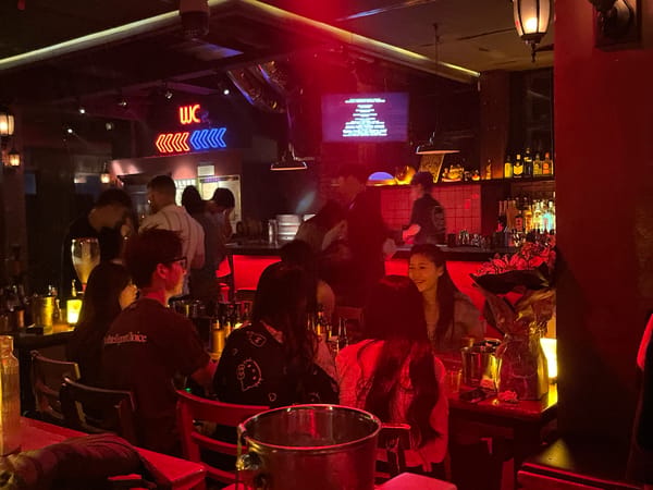 Casual evening socializing and pool games at Liangjiang bar