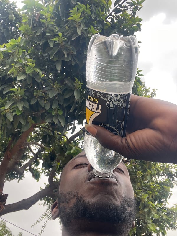 Man drinks TEEM SODA from plastic bottle