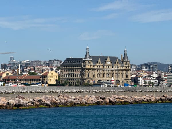 Ferry passengers document Haydarpaşa Terminal views from Istanbul waters