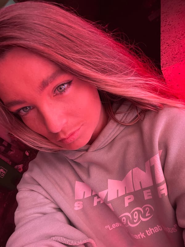 Selfies under red light in a dim North Kuta spot