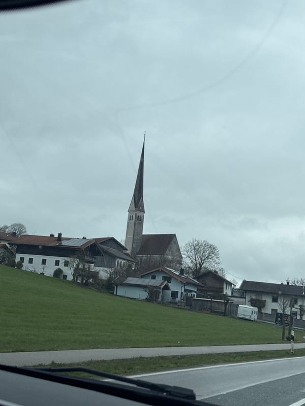 Church steeple viewed from moving vehicle in Bad Endorf