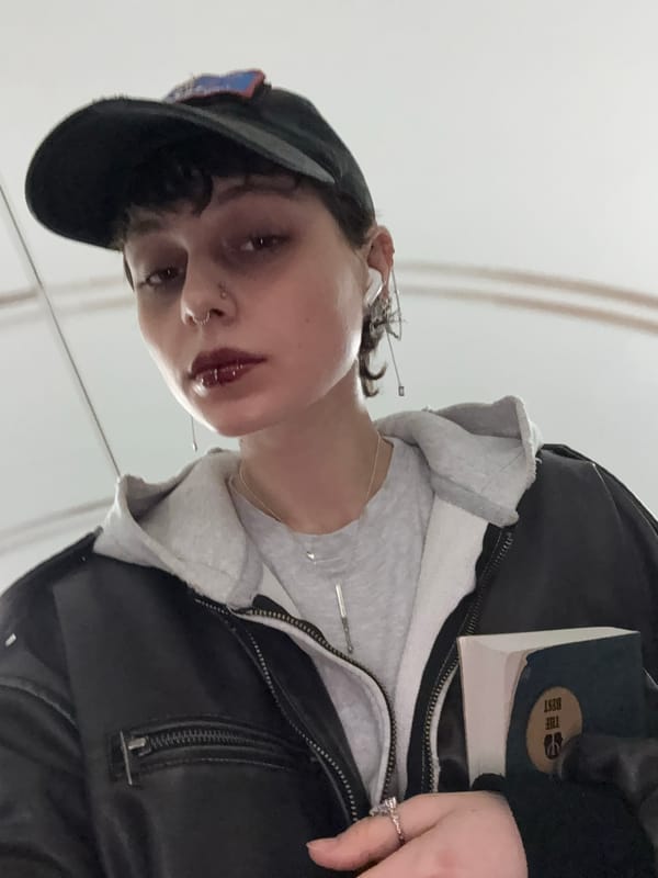 Person with piercings and dark makeup photographed in Moscow