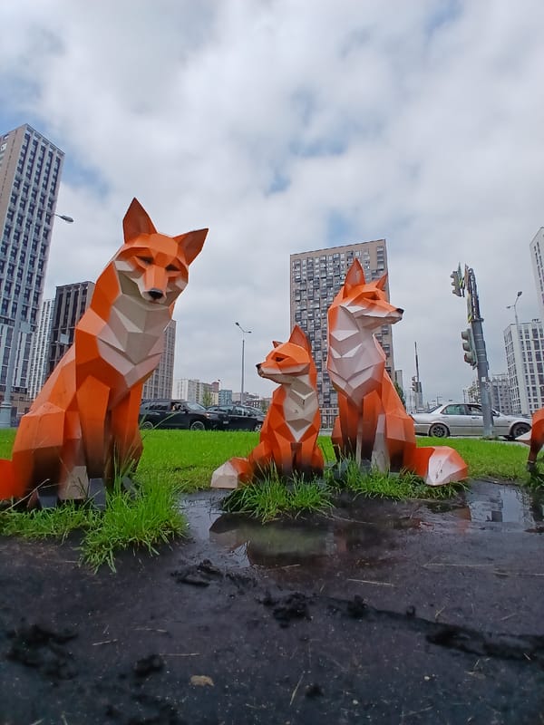 Rainy morning around Yekaterinburg's Atrium district with fox sculptures
