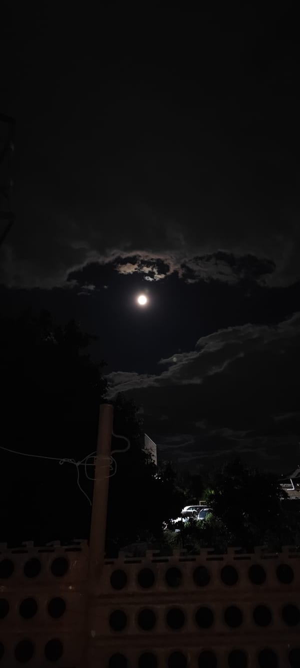 Full moon observed through clouds over Yerevan, Armenia