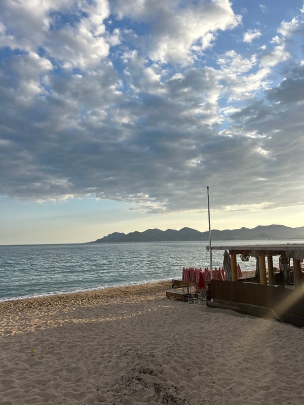 Tourists enjoy typical beach day activities in Cannes waterfront
