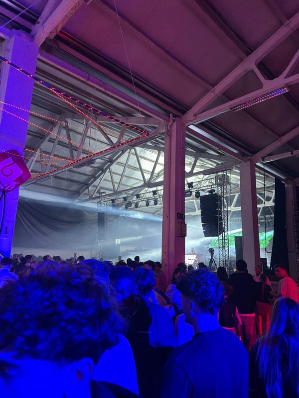Female DJ performs at packed indoor concert in Bragança