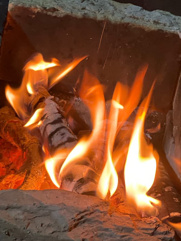 Wood fire burning down to glowing embers, Oskemen