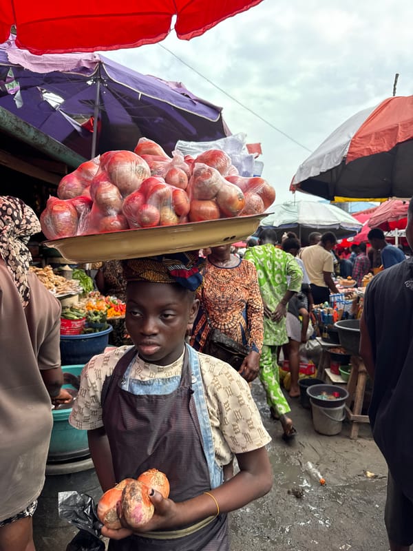 Nigerian market vendors and residents captured in morning commerce