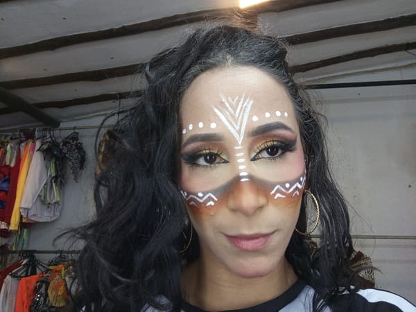 Woman with elaborate face paint photographed in Porlamar, Venezuela