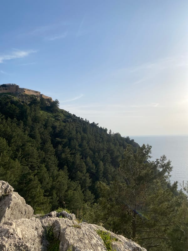 Tourist documents afternoon walk through historic Alanya Castle grounds
