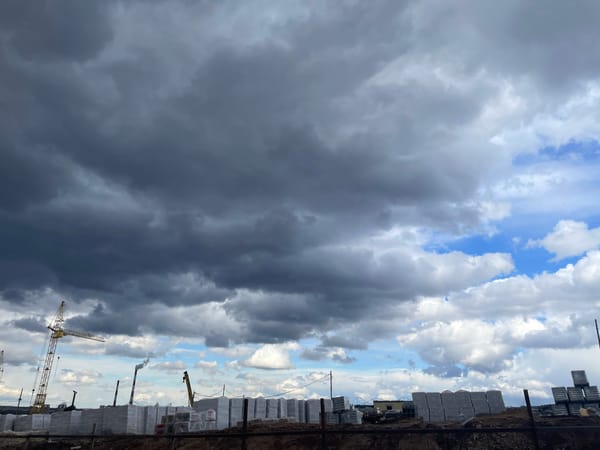 Construction sites documented under stormy skies in Pervomaysky