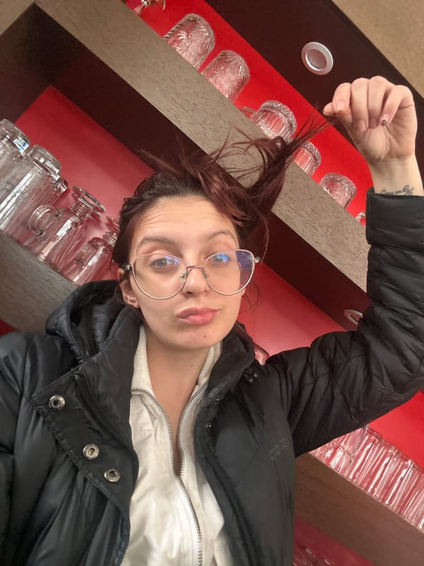 Woman takes selfies inside building in Tryavna, Bulgaria