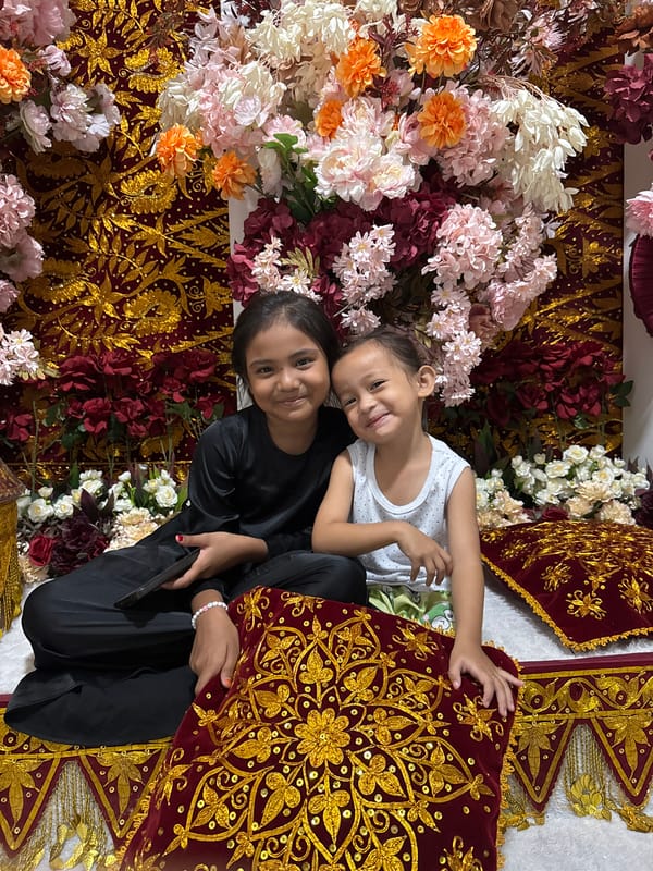 Evening celebration in Meunasah Raya with portraits and outdoor dining