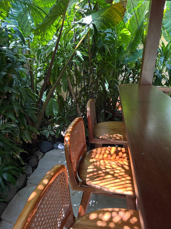 Early morning gathering at tropical pavilion in Kuta