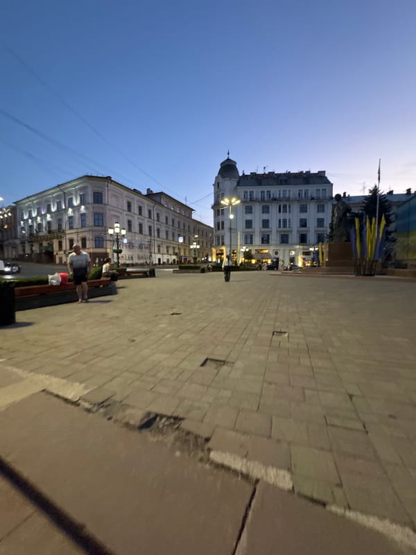 Chernivtsi city center at twilight, streets and square