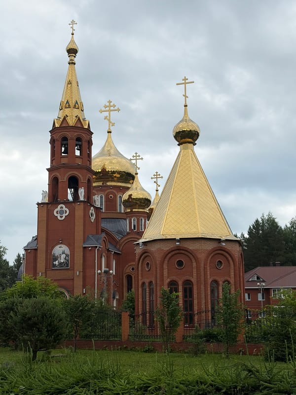 Orthodox church with golden domes observed by witness