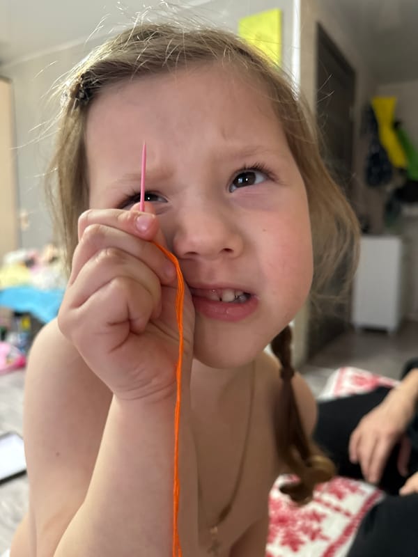 Children crafting with embroidery materials in Кипчак, Russia