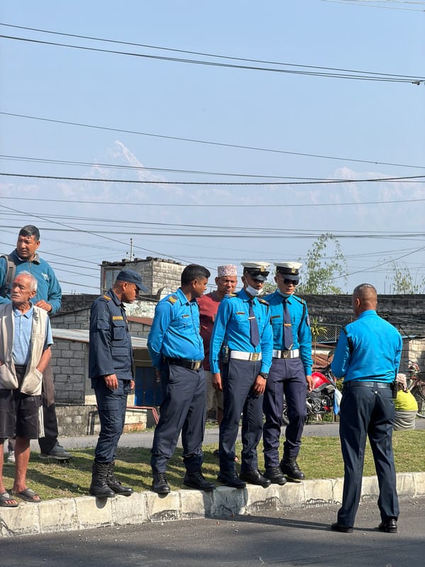 Police officers line up along roadside in Pokhara