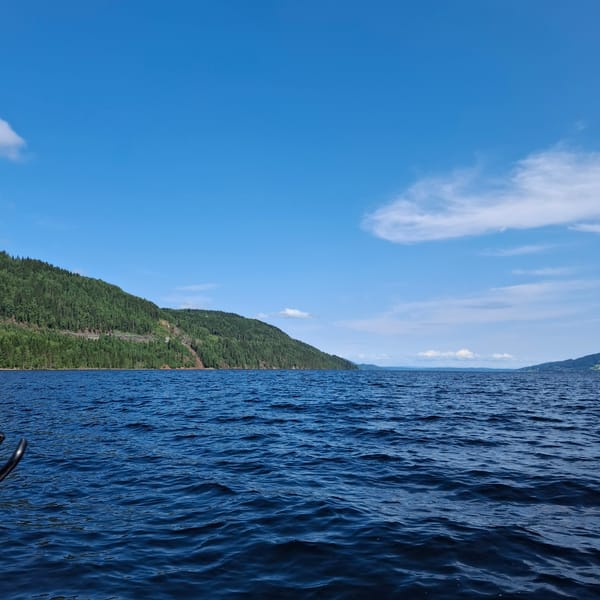 Boating across calm blue waters near Minnesund, Norway