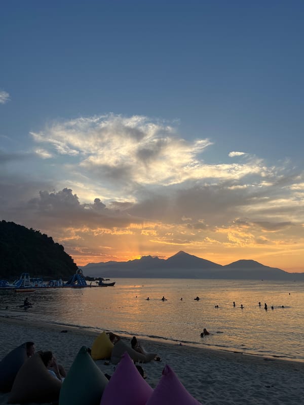 Sunset beach gathering with live music documented in Đà Nẵng