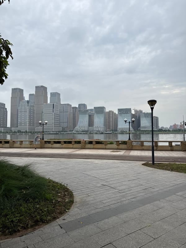Movement on a Tianhe waterfront promenade, Guangzhou