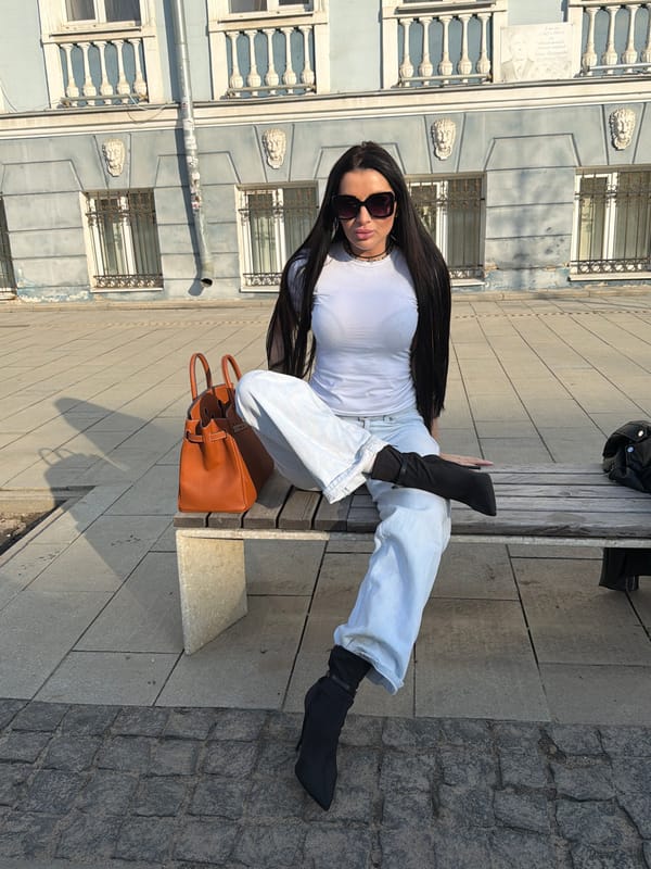 Woman rests on park bench in Voronezh