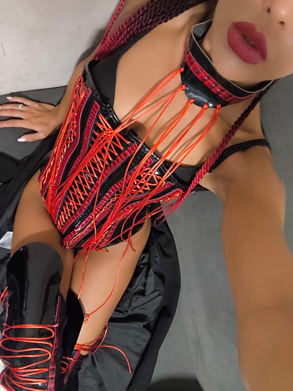 Black and red corset look, shot from two angles