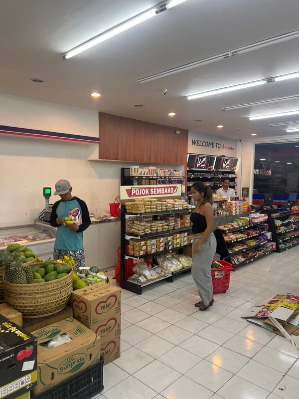 Shoppers browse and snack at Sukawati convenience store