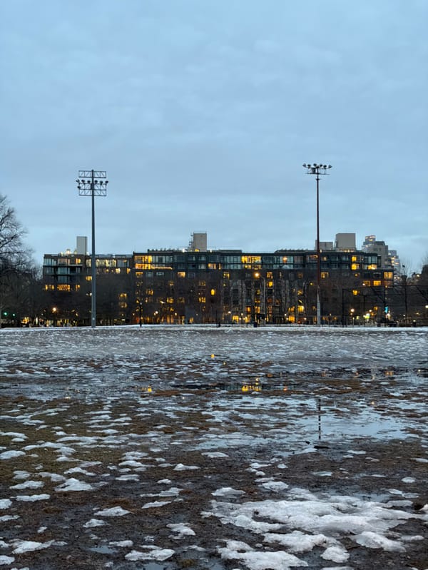 Dusk cityscape with melting snow documented in New York