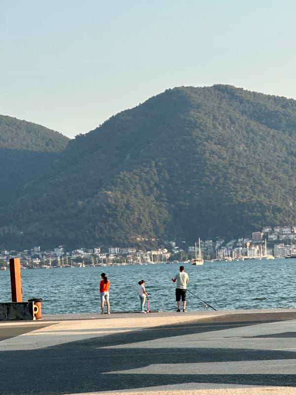 Evening stroll along Fethiye's waterfront promenade at sunset