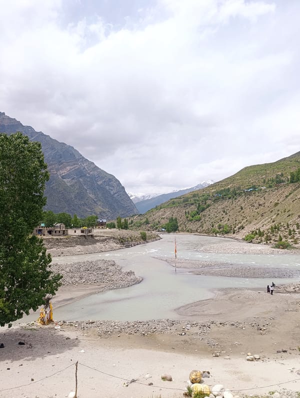 Royal Enfield stop in Gondhla's glacial river valley